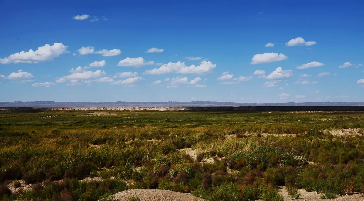 Ruins of Yumen Pass standing tall against the endless Gobi Desert