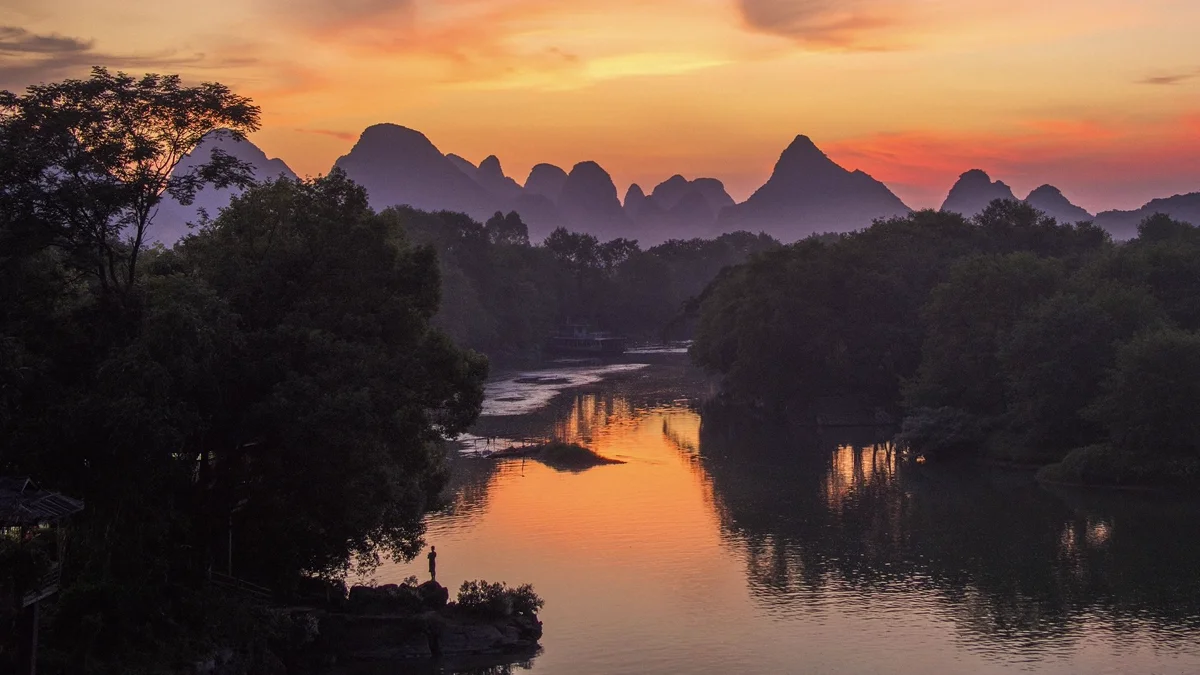 Li River with mountain reflection in calm water