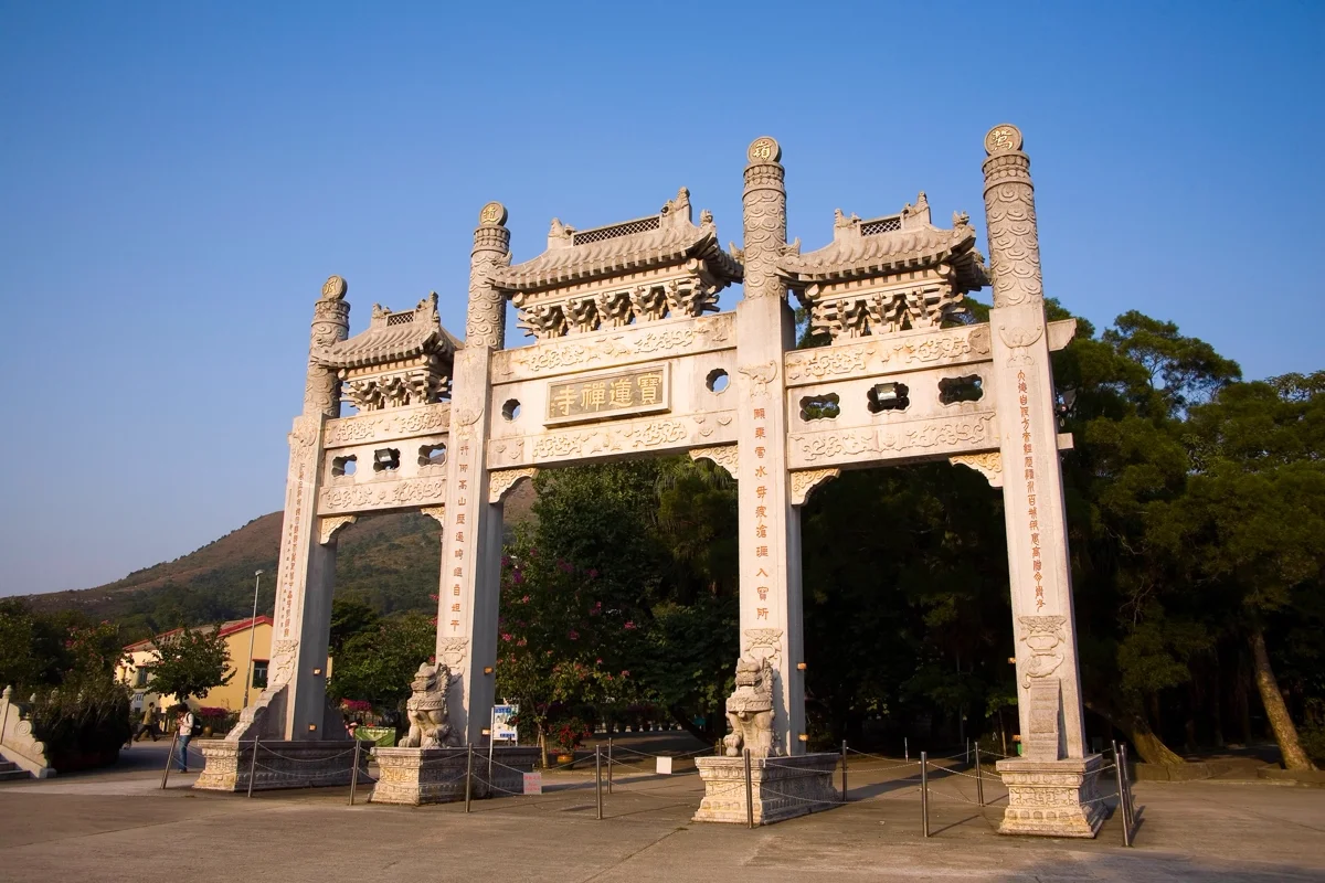 "Po Lin Monastery temple architecture with mountains"