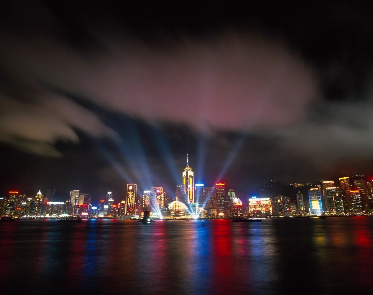 "Hong Kong skyline at night with harbour reflections"