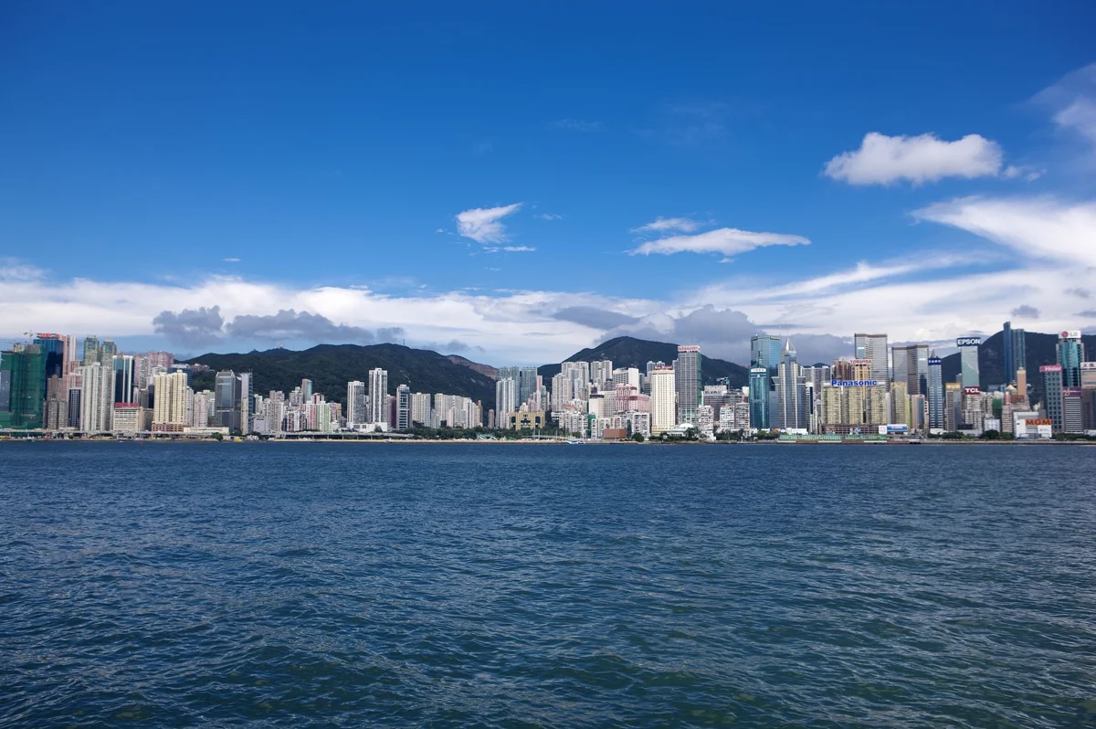 Victoria Harbour skyline at dusk with evening lights