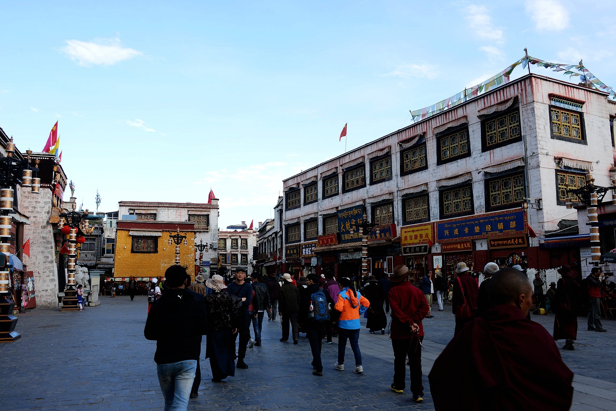 Pilgrims walking the Barkhor kora circuit, surrounded by traditional Tibetan architecture