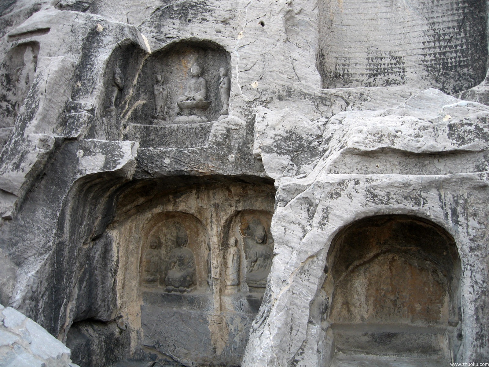 Binyang Cave interior with carved Buddha figure