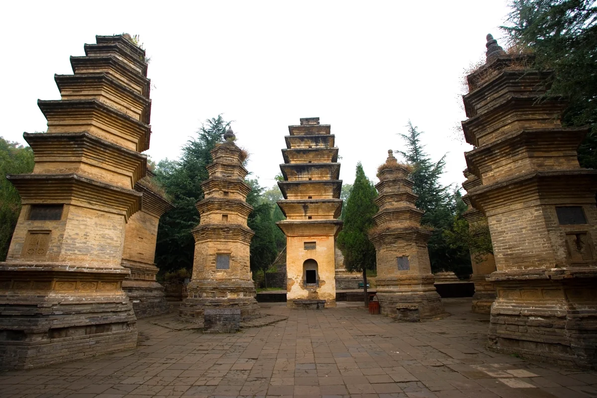 Shaolin Temple Pagoda Forest — ancient stone pagodas dotting a hillside