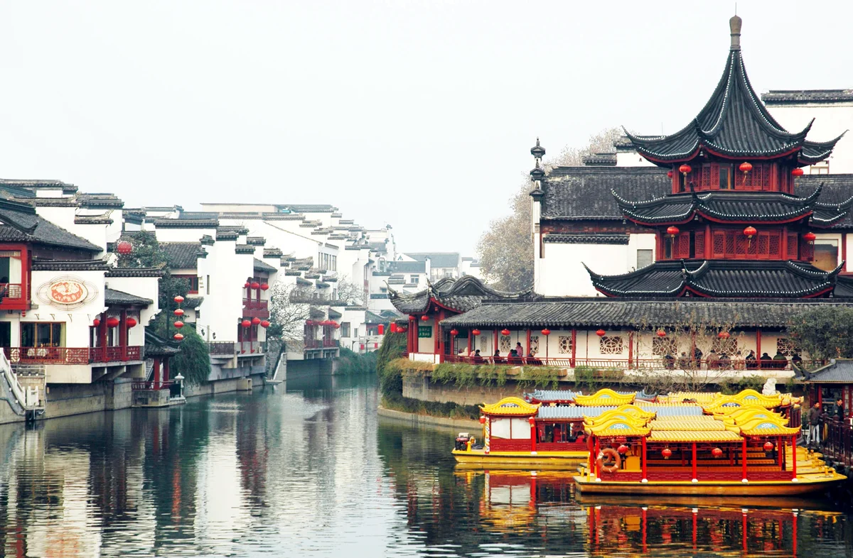 Fuzimiao night scene with glowing red lanterns reflecting beautifully in the Qinhuai River