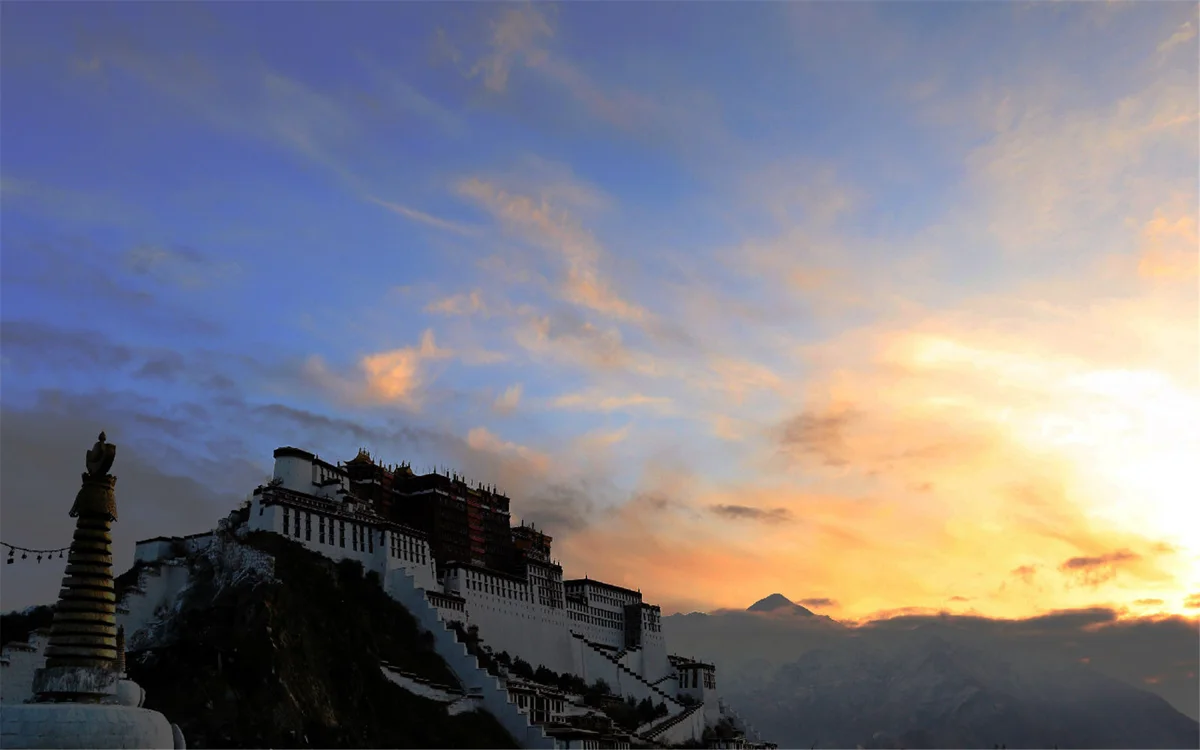 One of the Potala's inner halls, where pilgrims gather before sacred thangkas and butter lamps