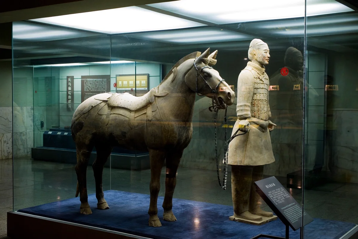 Close-up details reveal the individualized faces, intricate armor patterns, and expressive features of individual terracotta warriors