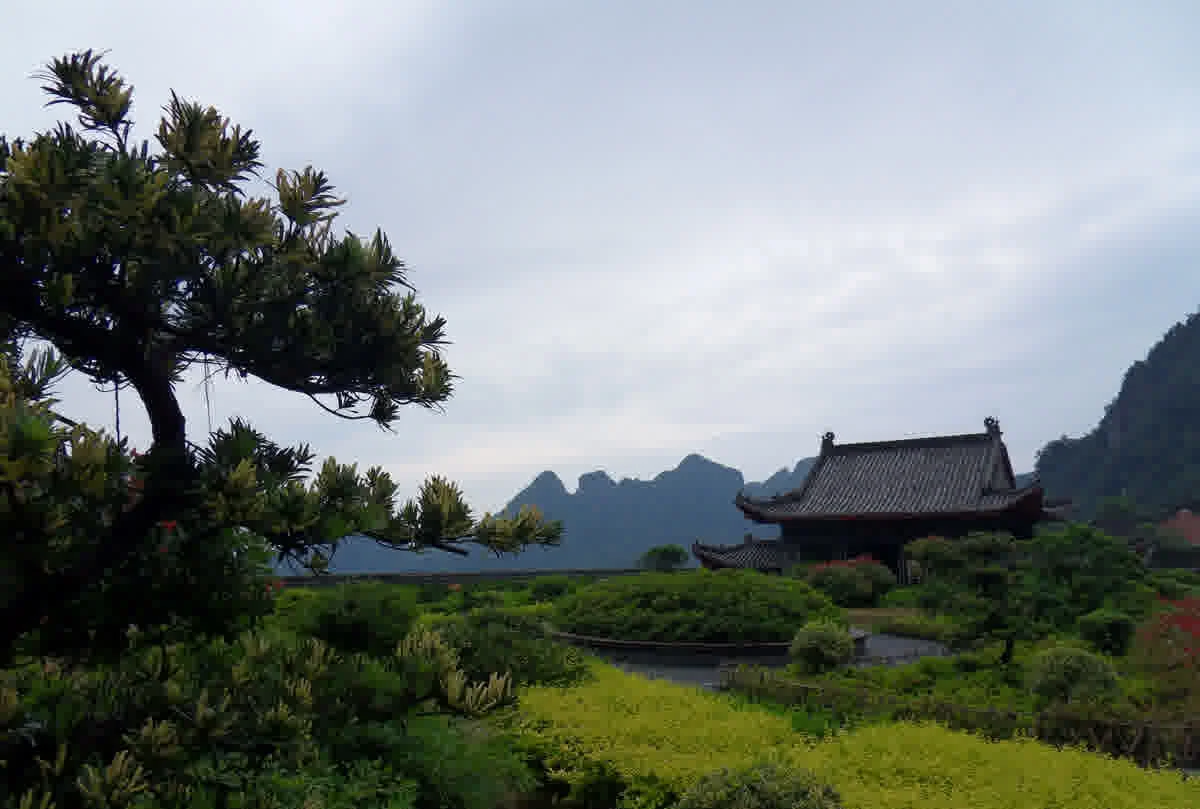 Taihe Palace with its distinctive red walls and prayer flags near the summit
