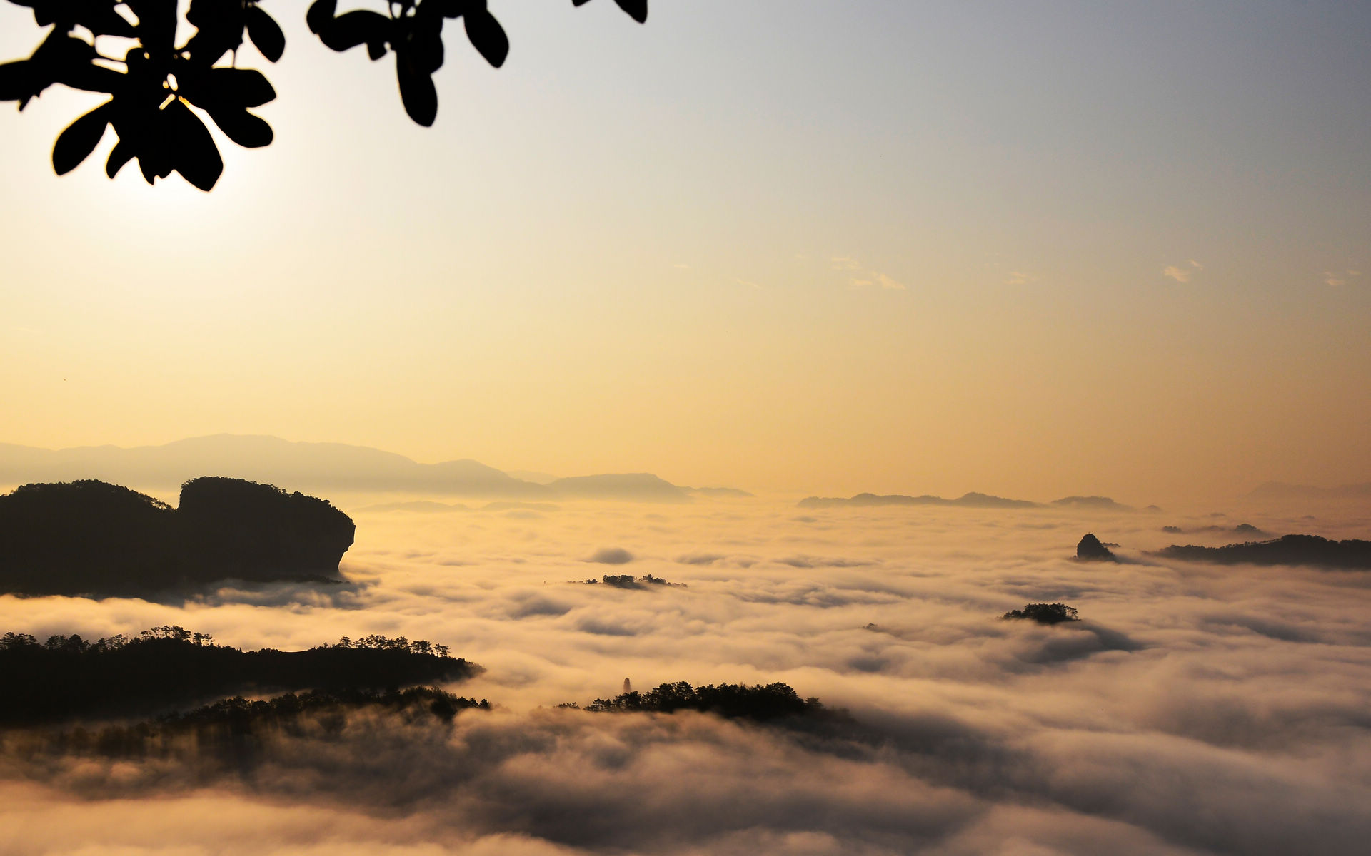 Misty mountain peaks at sunrise