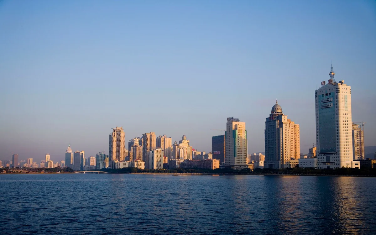 Xiamen skyline with the sea bridge stretching across the water at golden hour