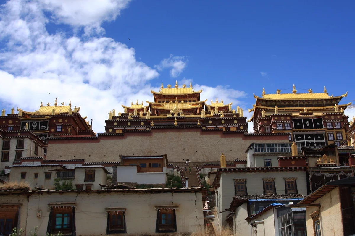 Ganden Sumtseling Monastery Tibetan temple against mountain